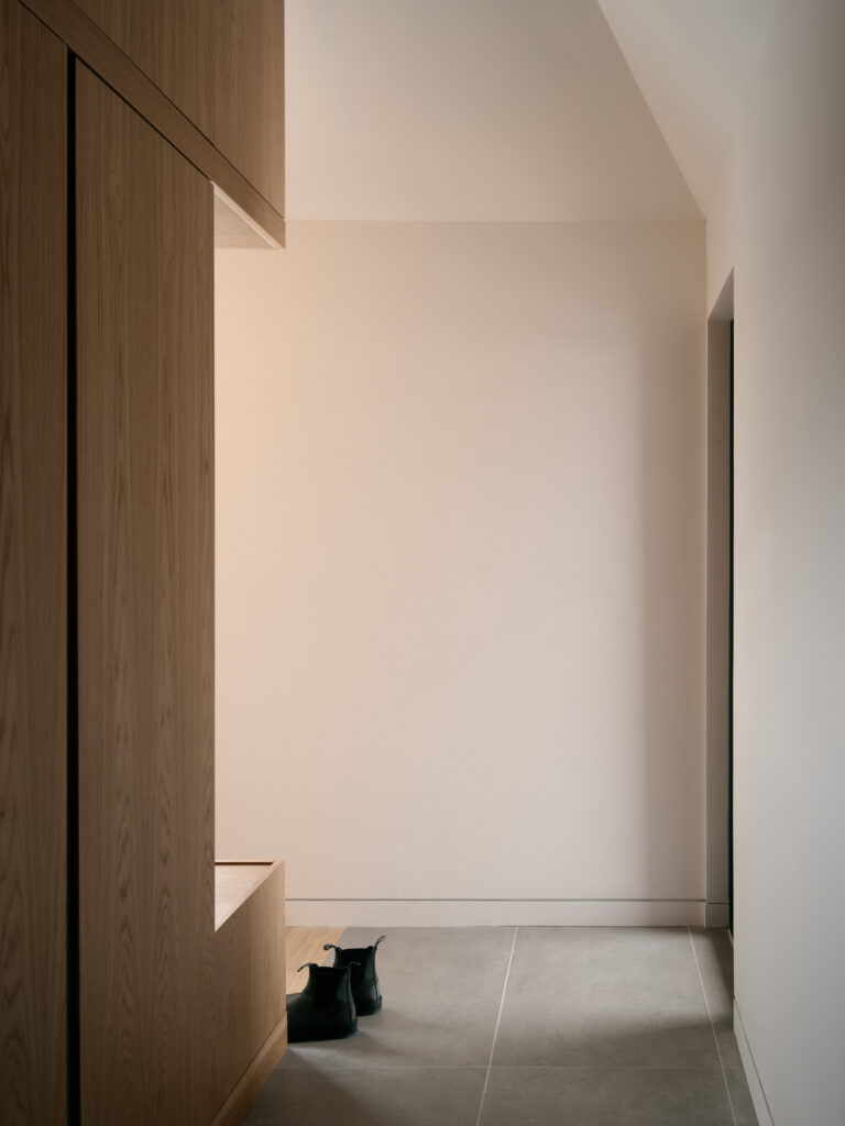 Modern residential architecture featuring a Stûv wood stove