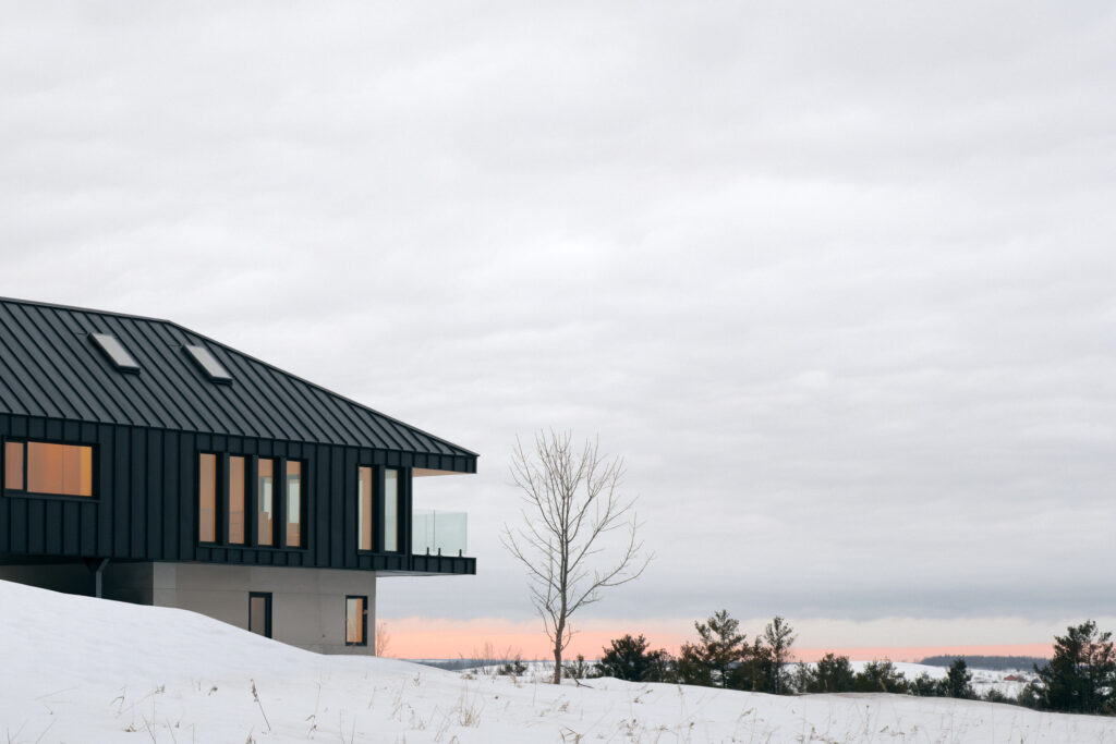 Contemporary home with fireplace overlooking the Trent Hills landscape